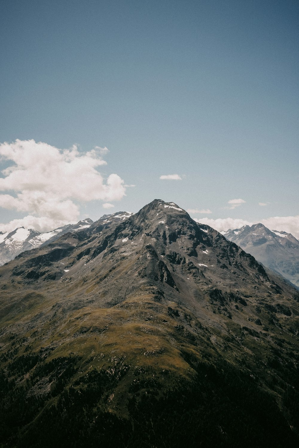 a very tall mountain with a sky background