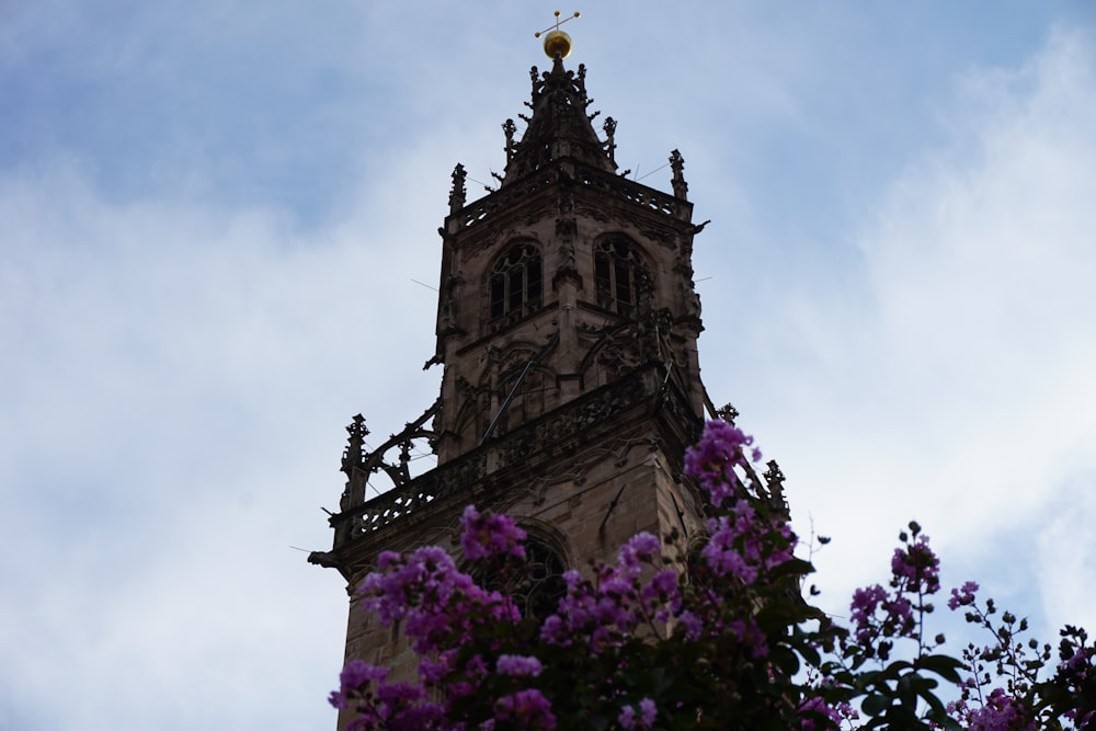 a tall tower with a clock on the top of it