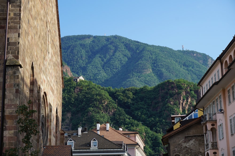 a city street with a mountain in the background