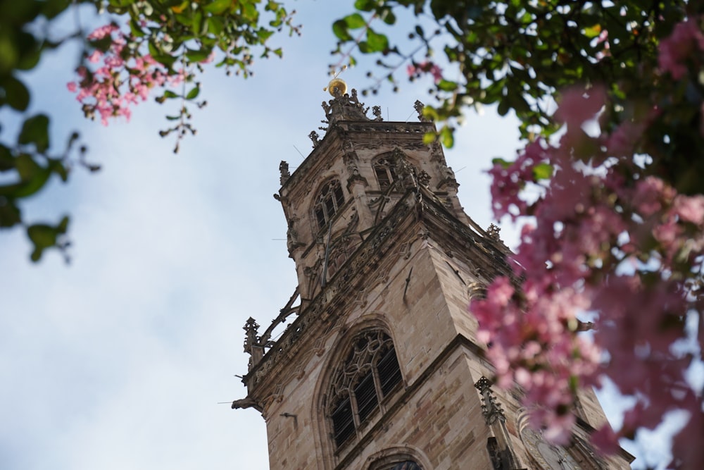 a tall tower with a clock on the top of it