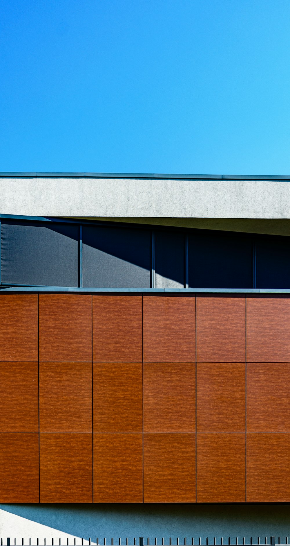 a large wooden building with a clock on the side of it