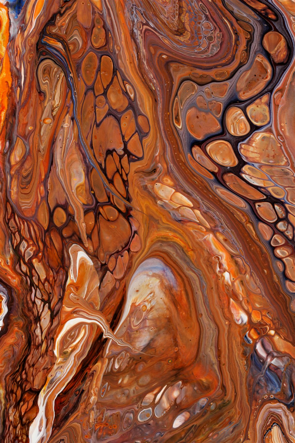 a close up of a marbled surface with a blue sky in the background