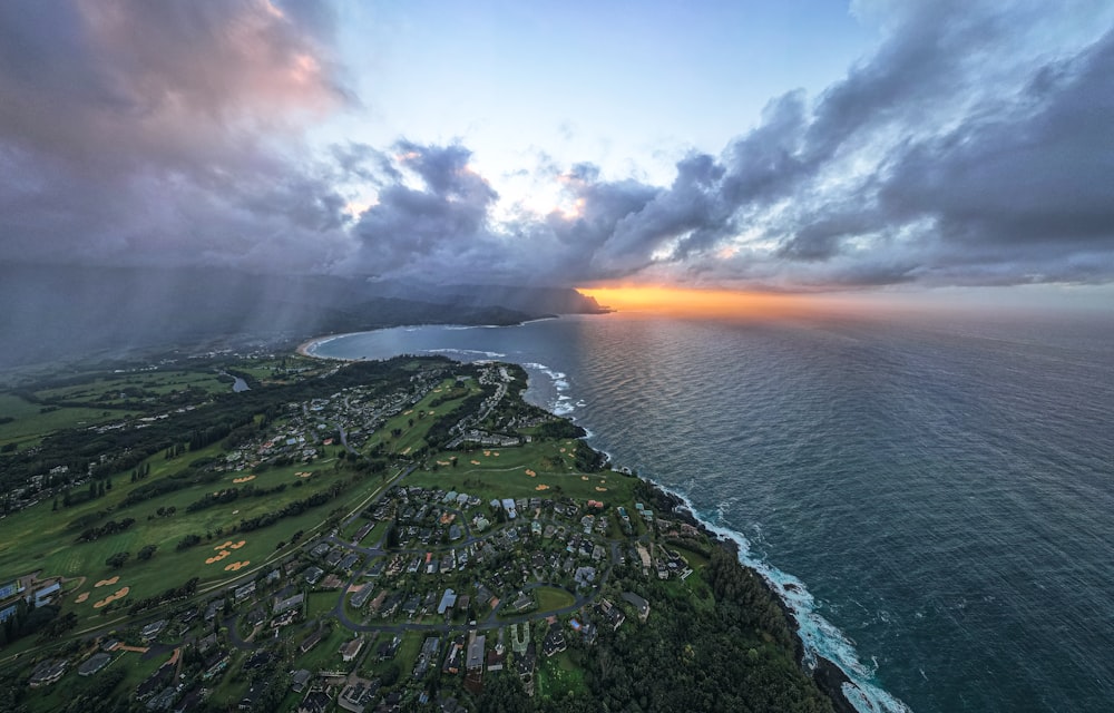 an aerial view of a golf course near the ocean