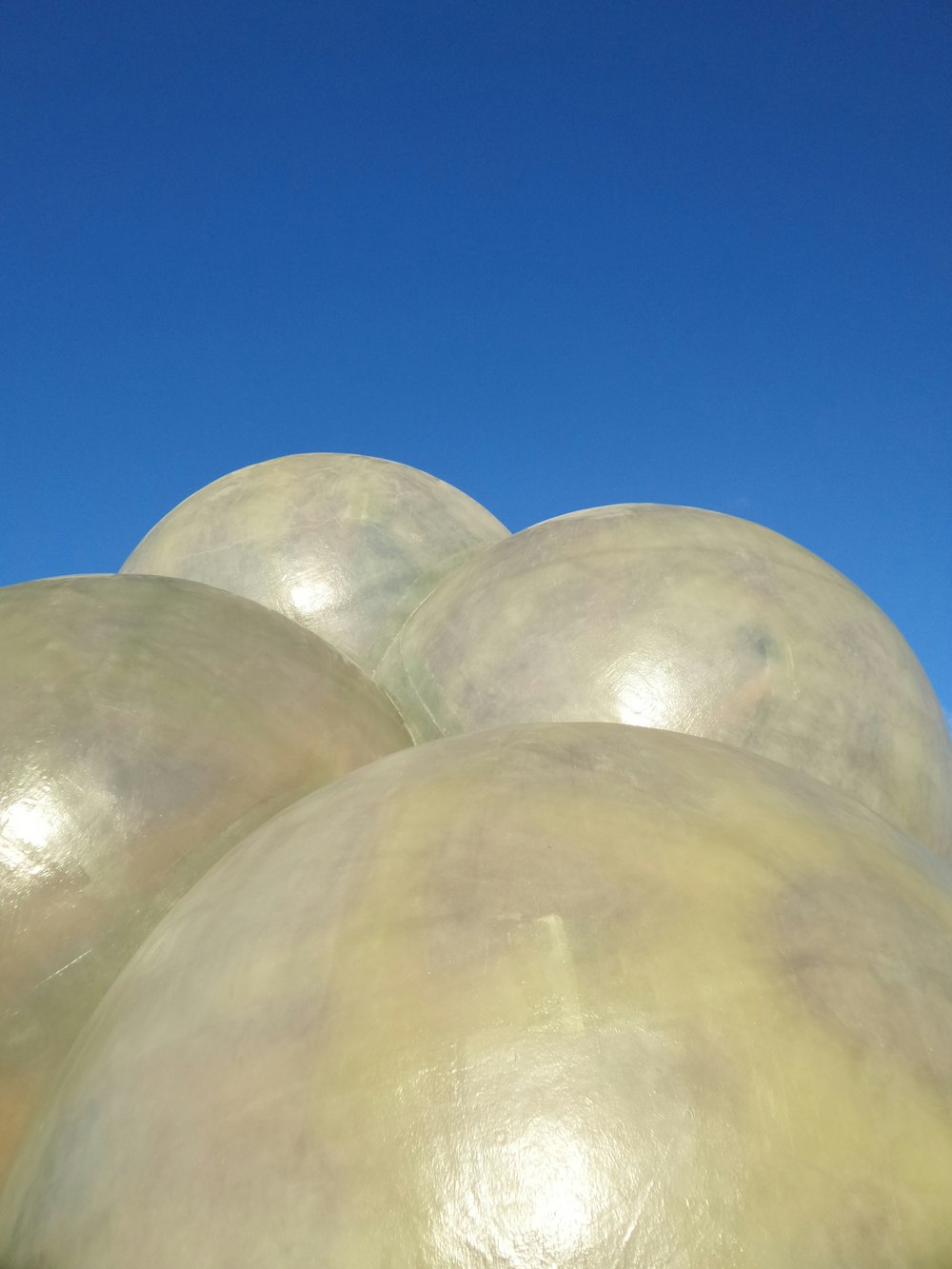a group of large white balls sitting on top of each other