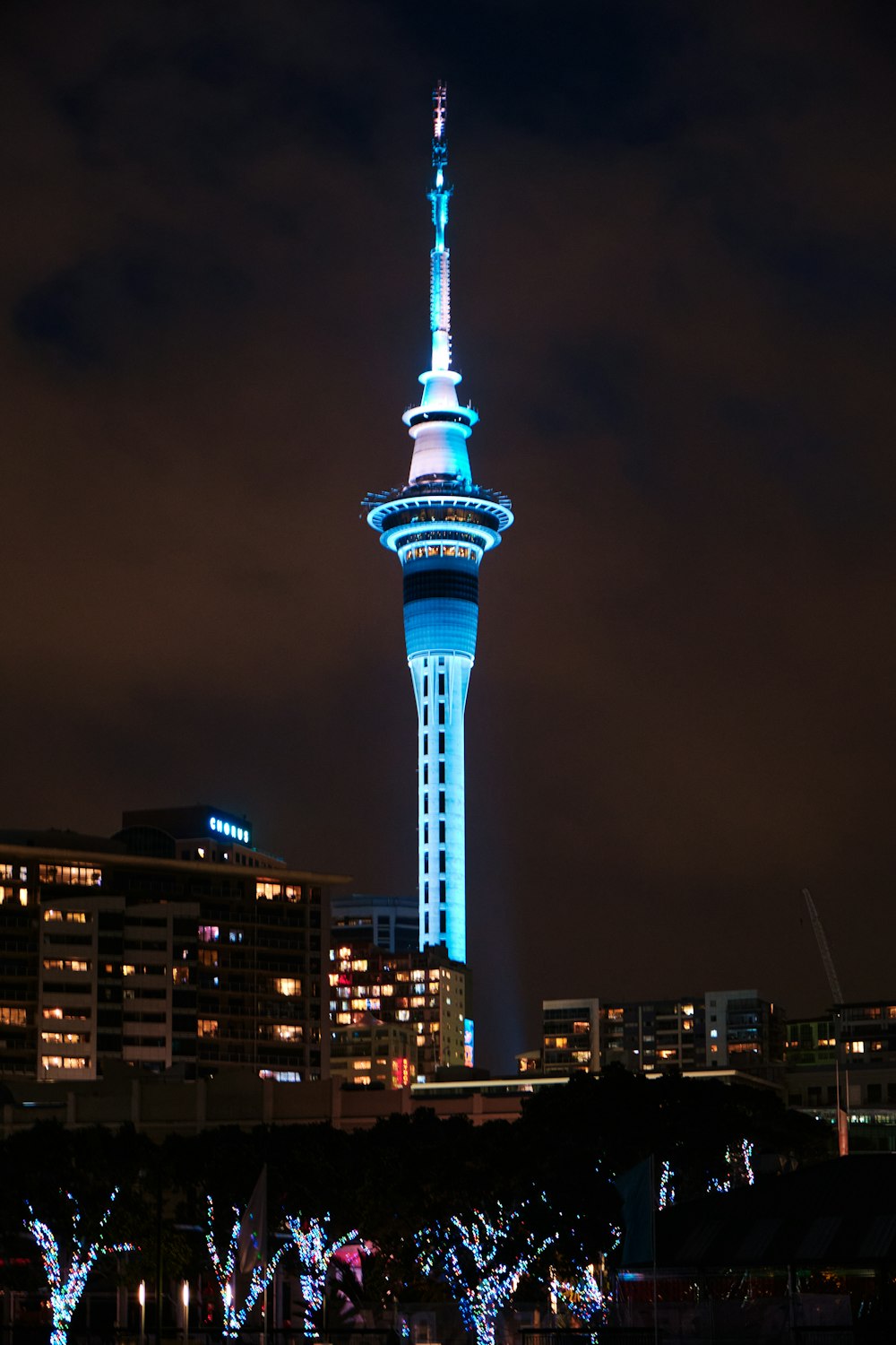 a very tall tower with a very bright light on it's side