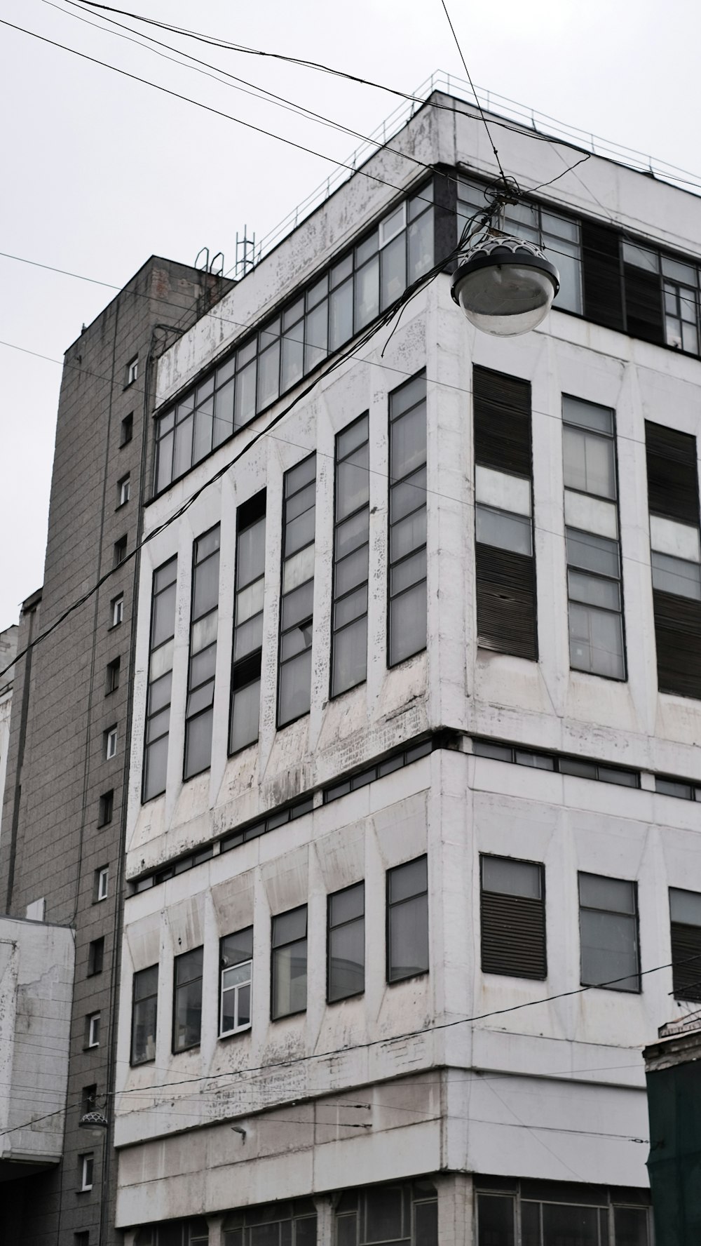 a tall white building with lots of windows