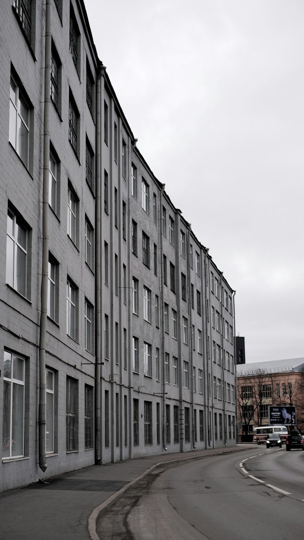 a very tall building sitting on the side of a road