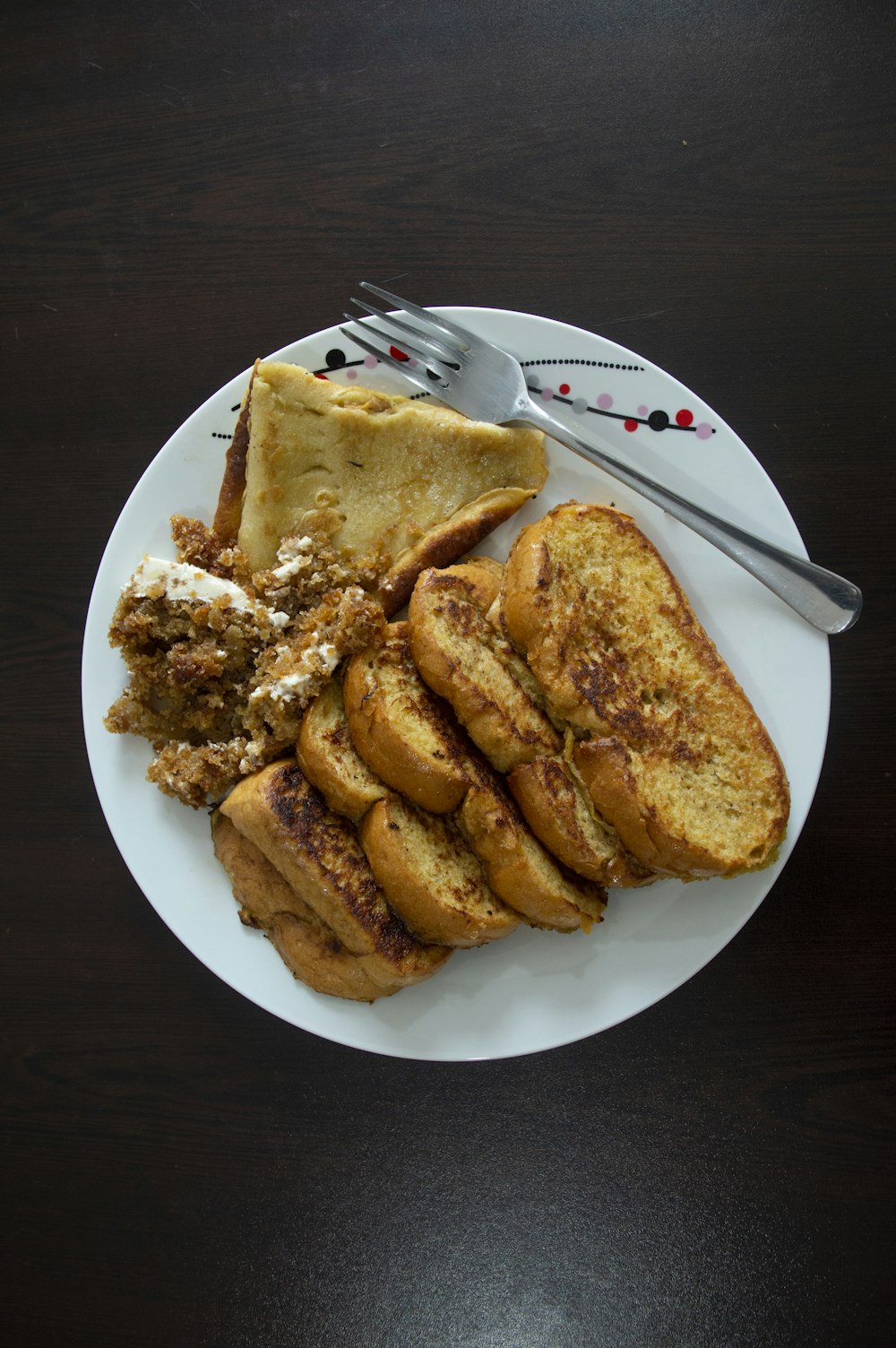 a plate of food on a table with a fork and knife