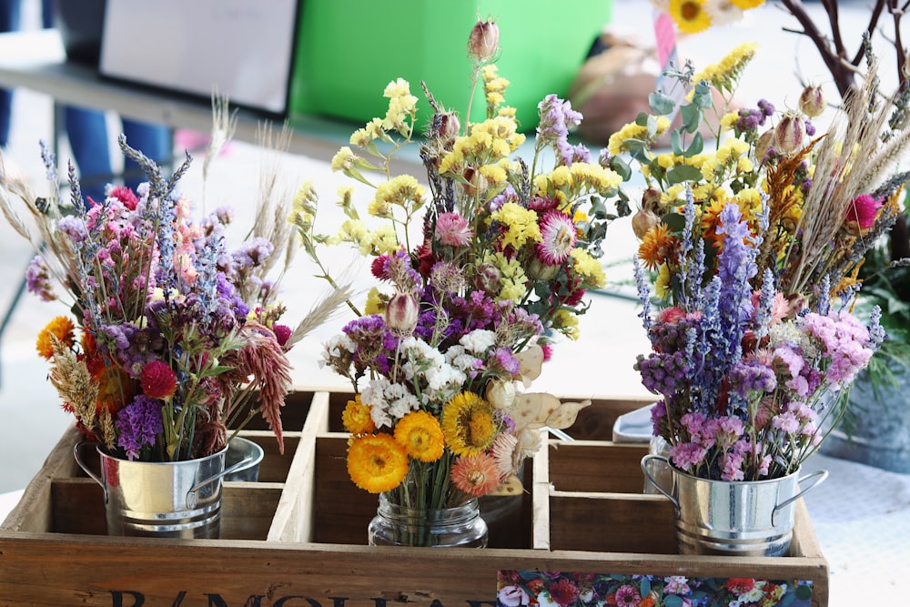 a bunch of flowers that are in a box