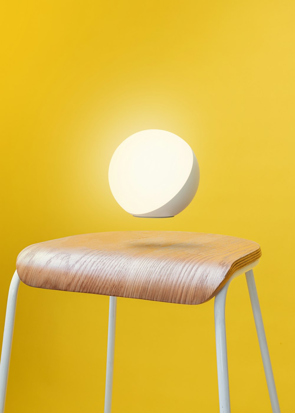 a wooden stool with a light on top of it