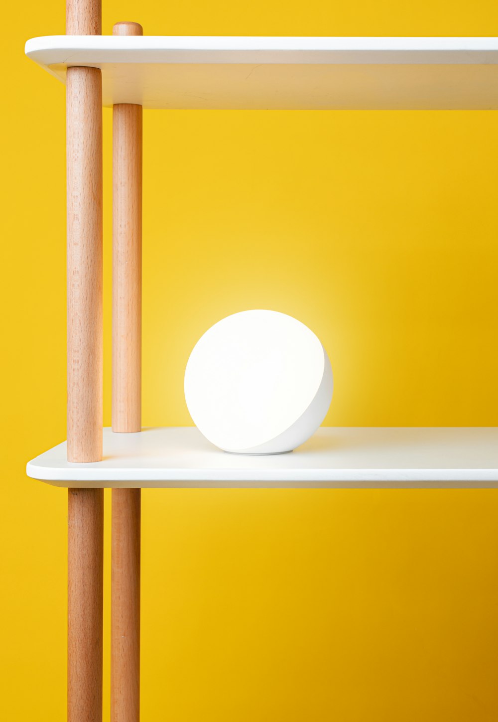 a white light sitting on top of a shelf