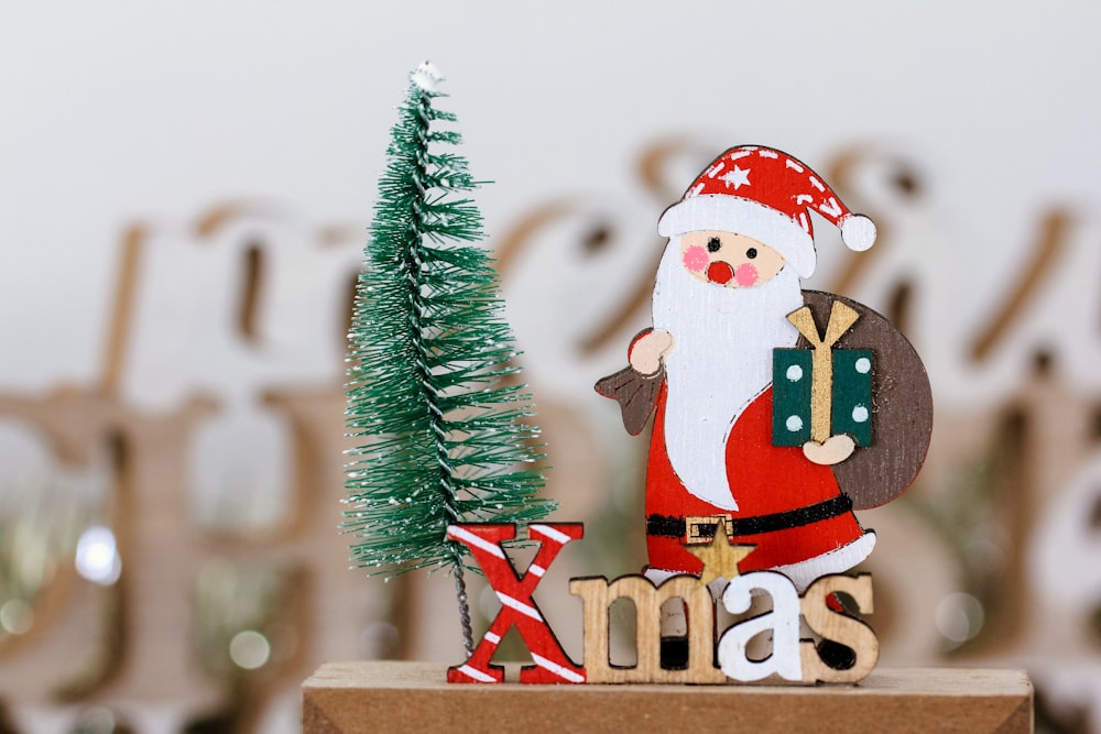 a christmas decoration with a santa clause holding a bag