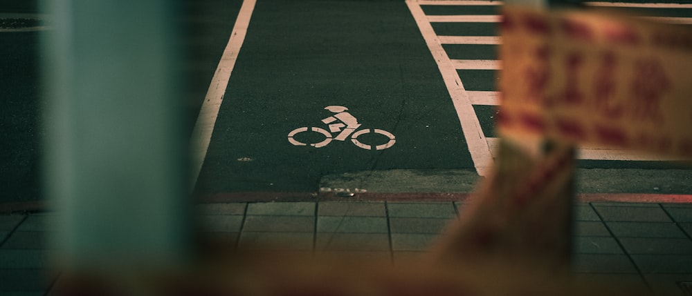 a bike lane with a bicycle sign on it