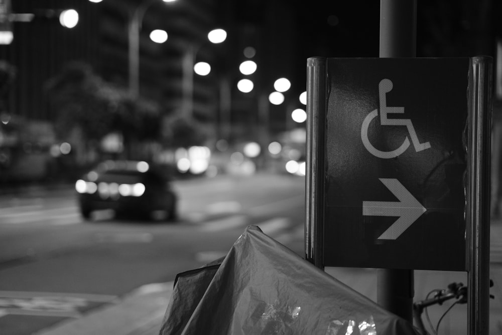 a handicapped parking sign on a city street