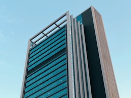 a tall building with a sky background
