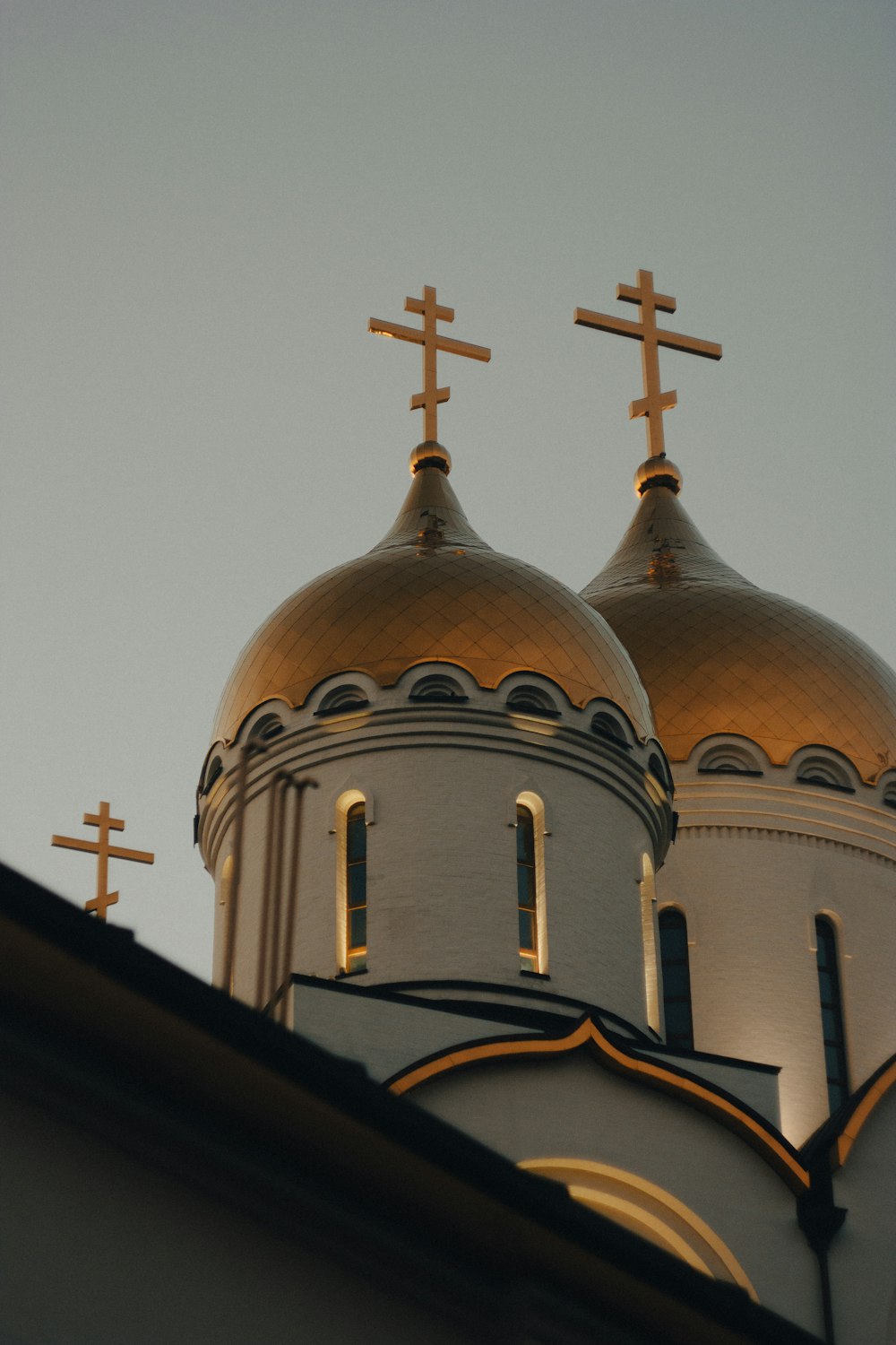 the top of a church with three crosses on it