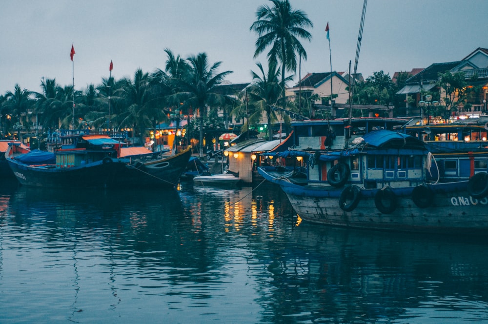 a group of boats that are sitting in the water