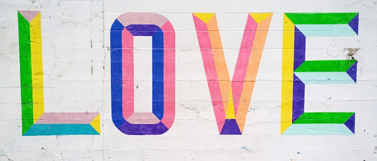 the word love painted on the side of a building