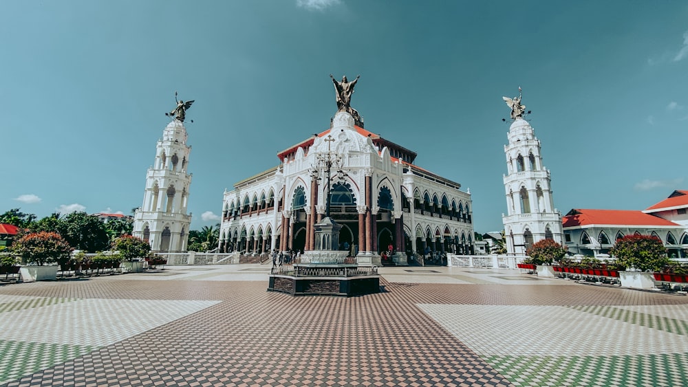 a large white building with statues on top of it