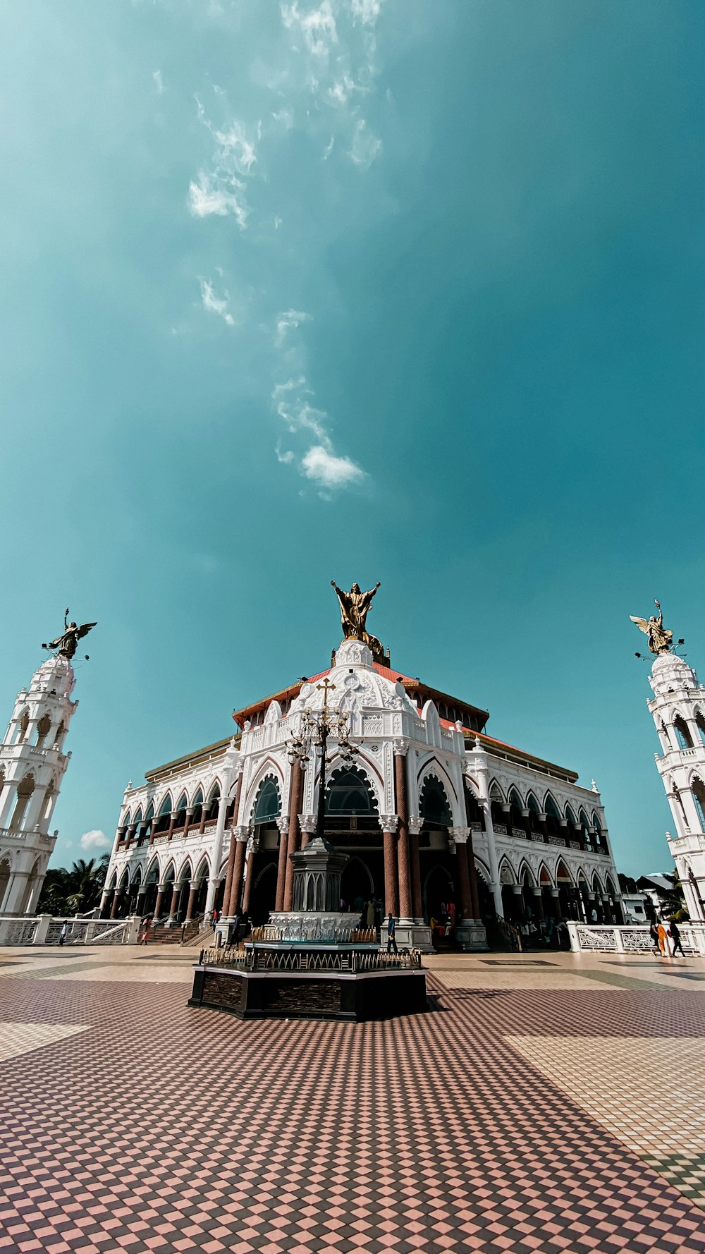 a large white building with statues on top of it