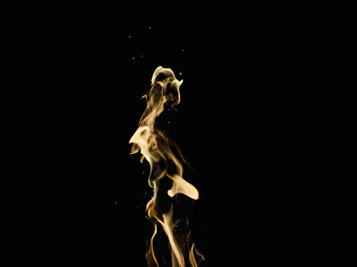 An abstract digital flame composed of intertwining light strands, symbolizing the trifold flame at the heart of kalishiva nova llc.