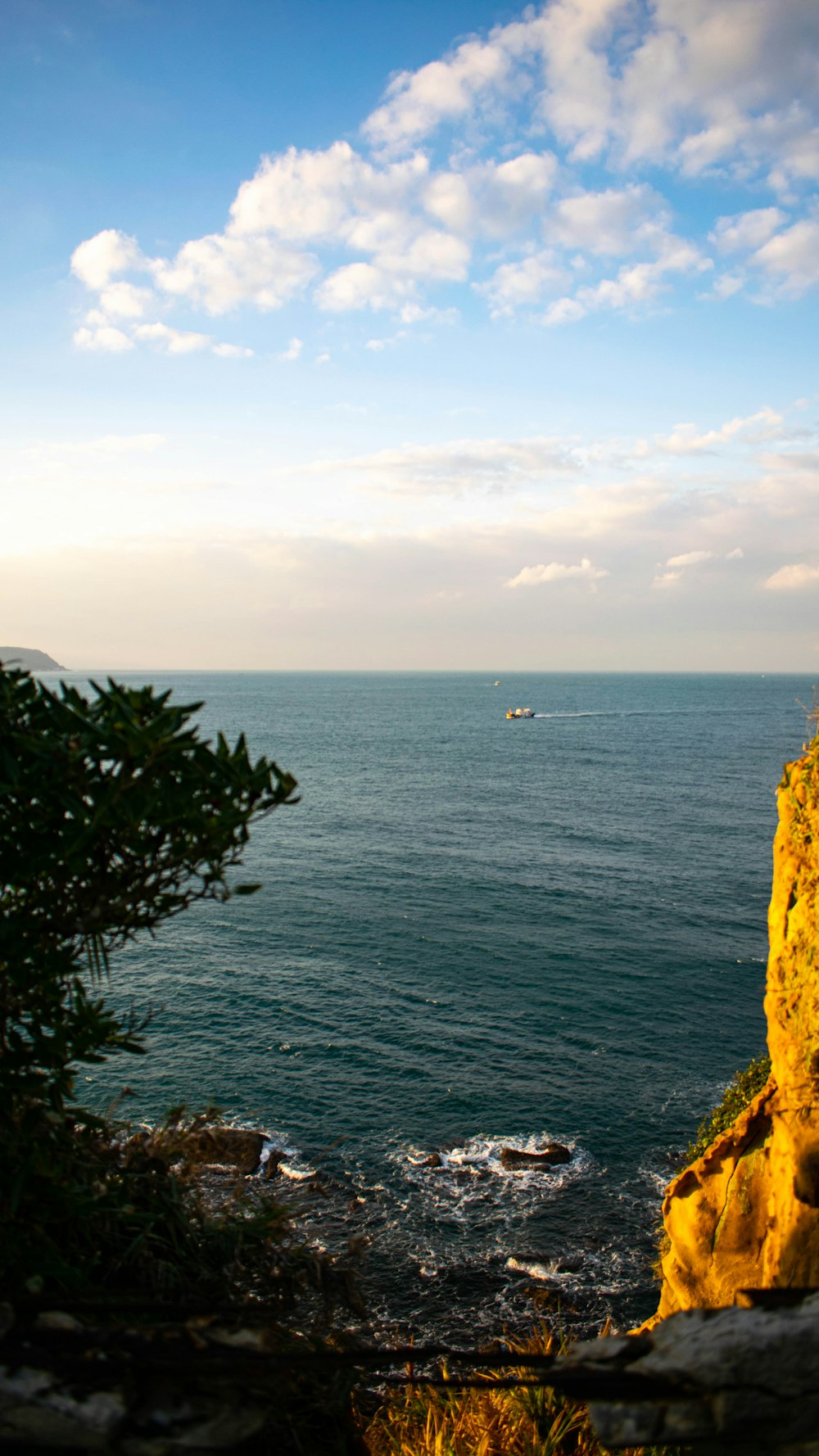 a view of a body of water from a cliff