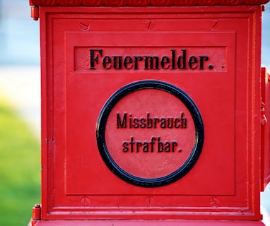 a red mailbox with a message written on it