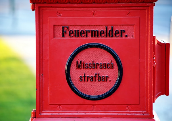 a red mailbox with a message written on it