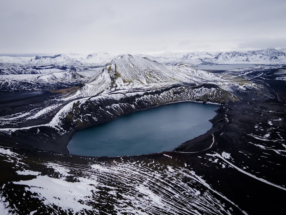 a mountain with a lake in the middle of it