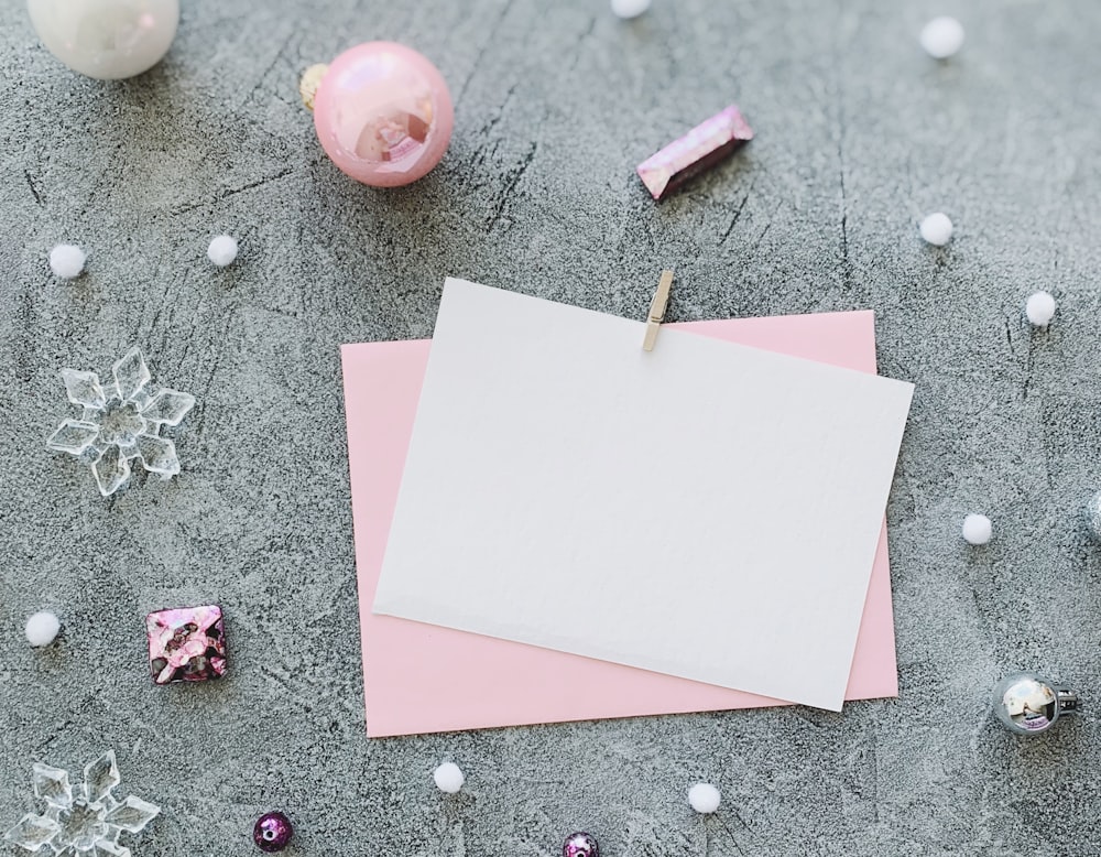 a piece of paper on top of a piece of pink paper