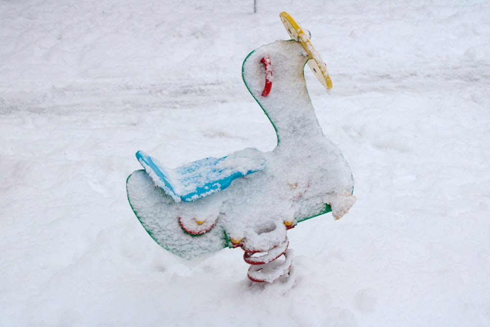 a snowboard that is sitting in the snow