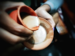 Close-up of traditional Arabian coffee being poured, symbolizing hospitality and culture.