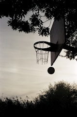 a basketball going through the hoop of a basketball court