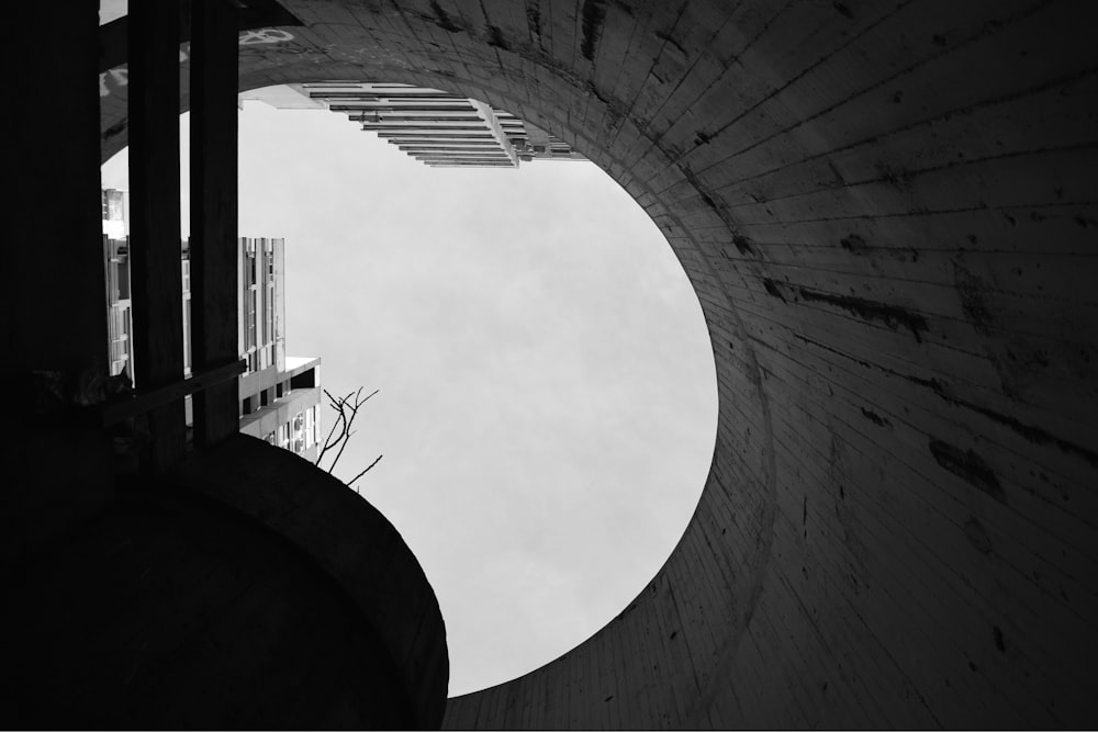 a view of a building through a hole in a wall