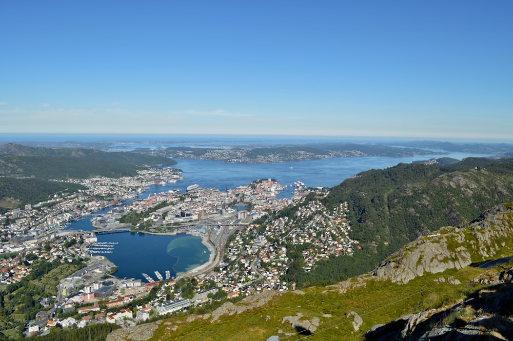 a view of a city and a lake from a hill