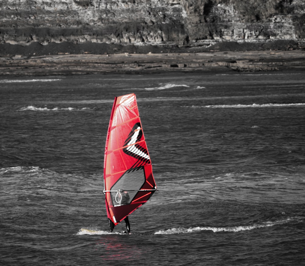 a person riding a surf board on top of a body of water