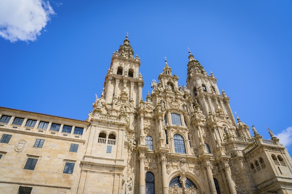 a very tall building with a clock on it's sideby Victoriano Izquierdo