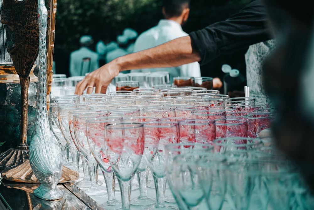 a table filled with lots of wine glasses