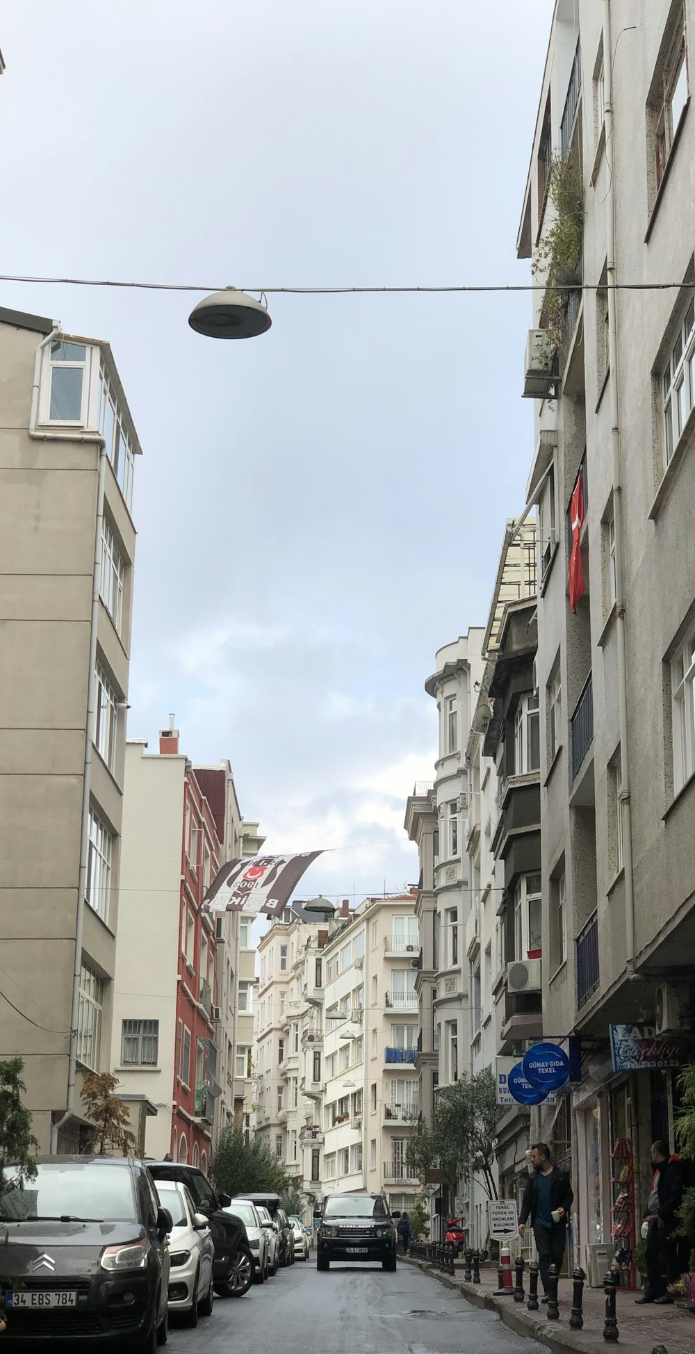 a street with cars parked on both sides of it