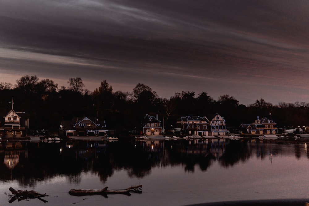 a body of water with a bunch of houses in the background