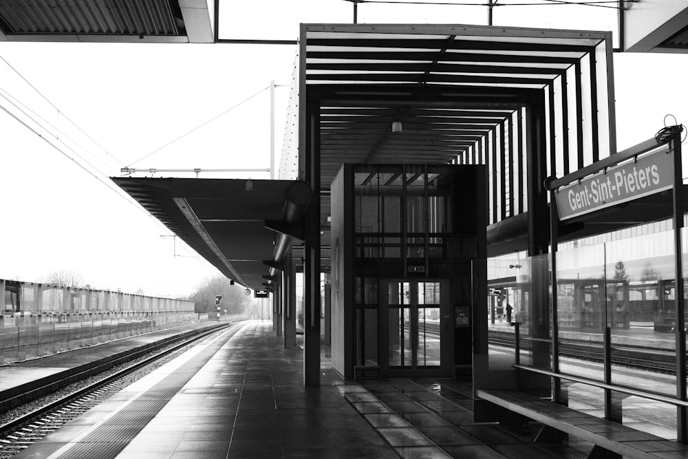 a black and white photo of a train station