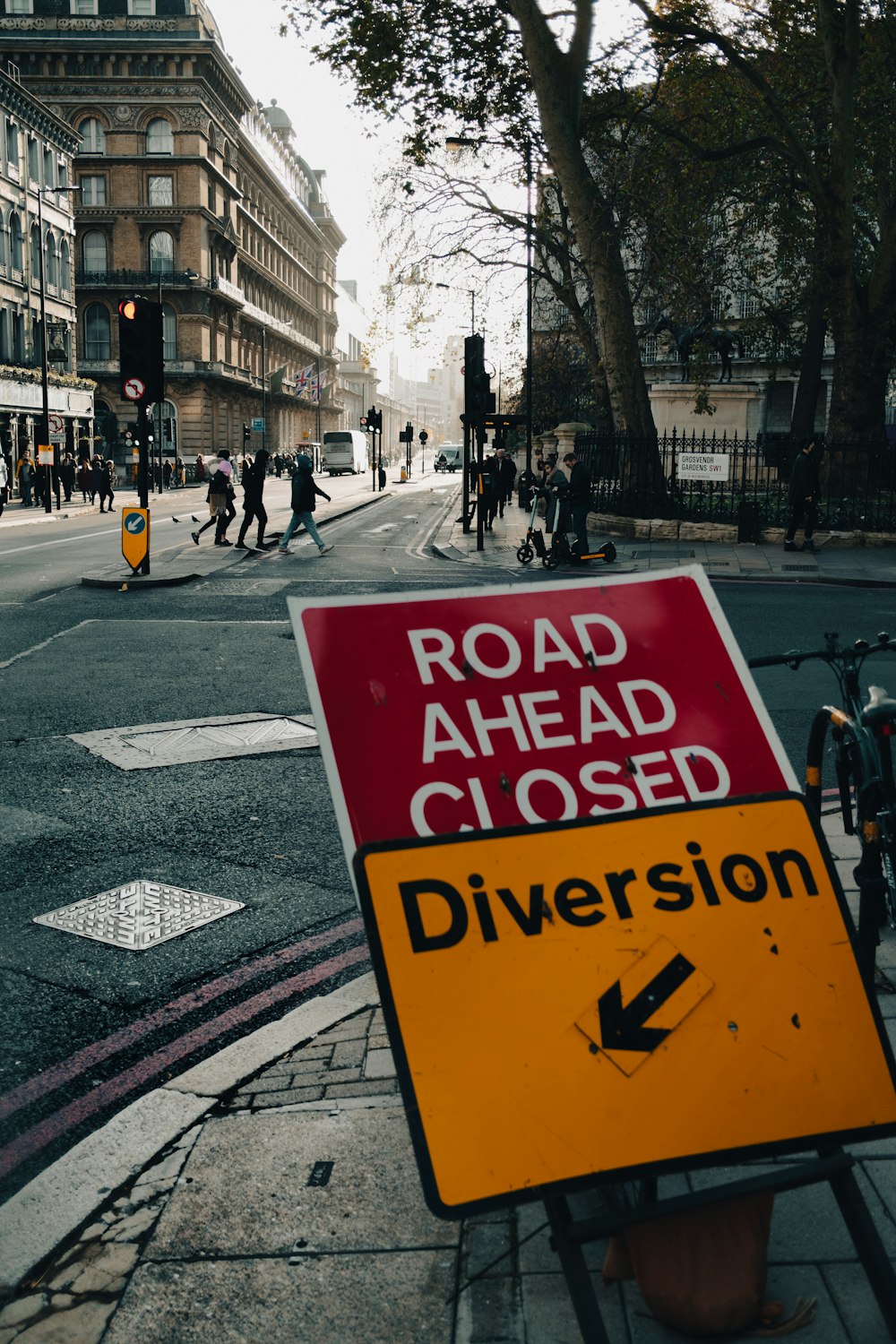 a road ahead closed sign on the side of the road