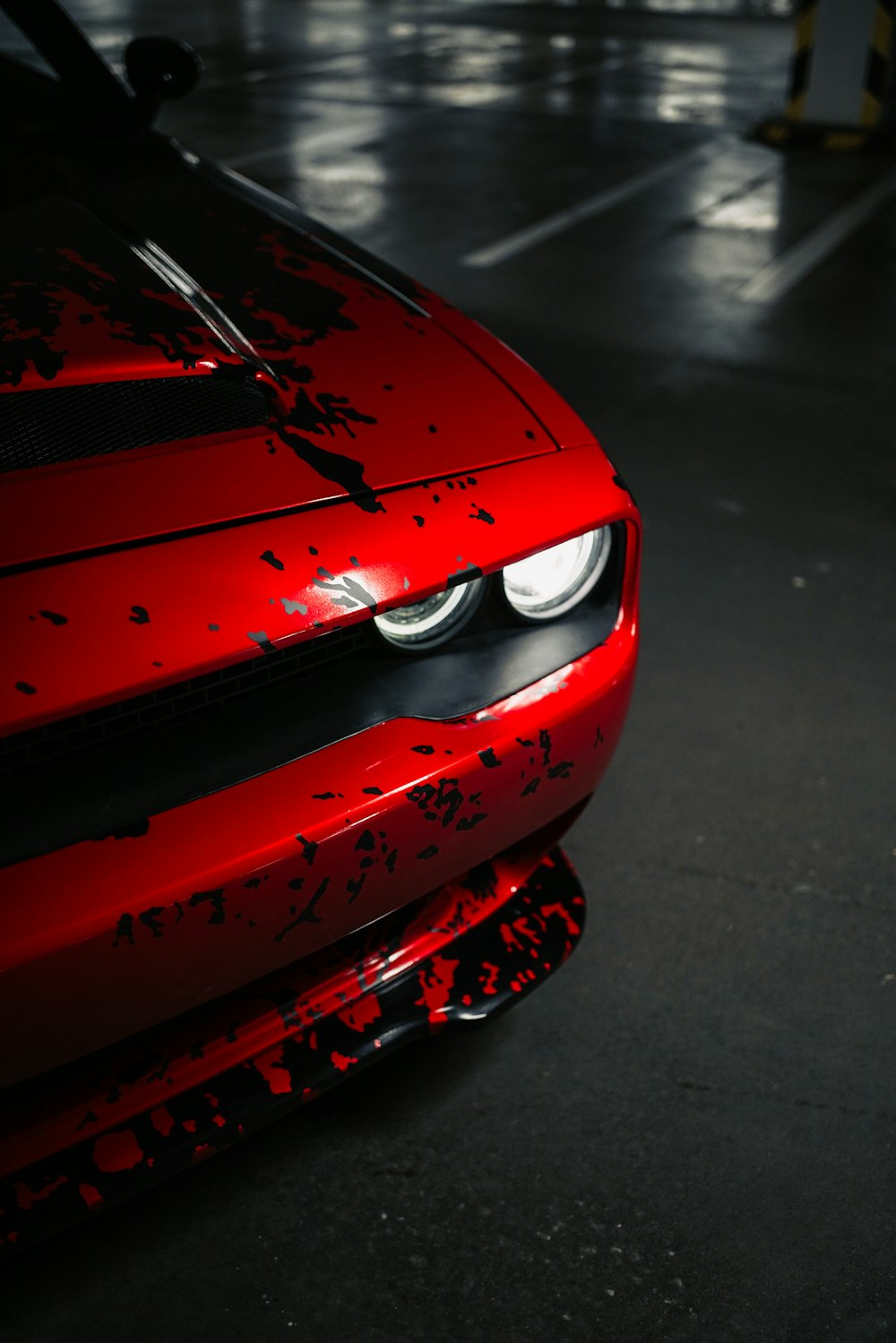 a close up of the front of a red sports car