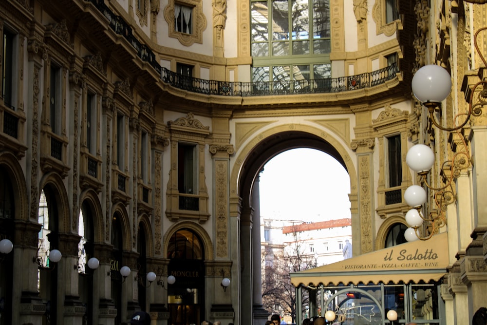 a group of people walking around a building