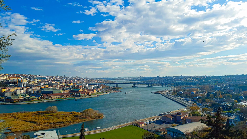 a view of a city and a river from a hill