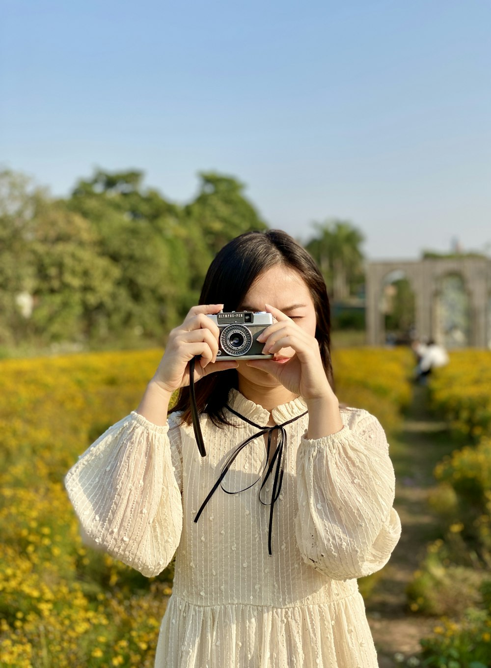 a woman taking a picture with a camera