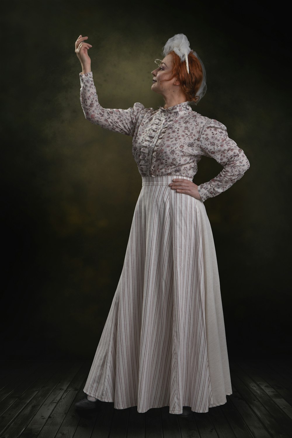 a woman in a white dress is smoking a cigarette