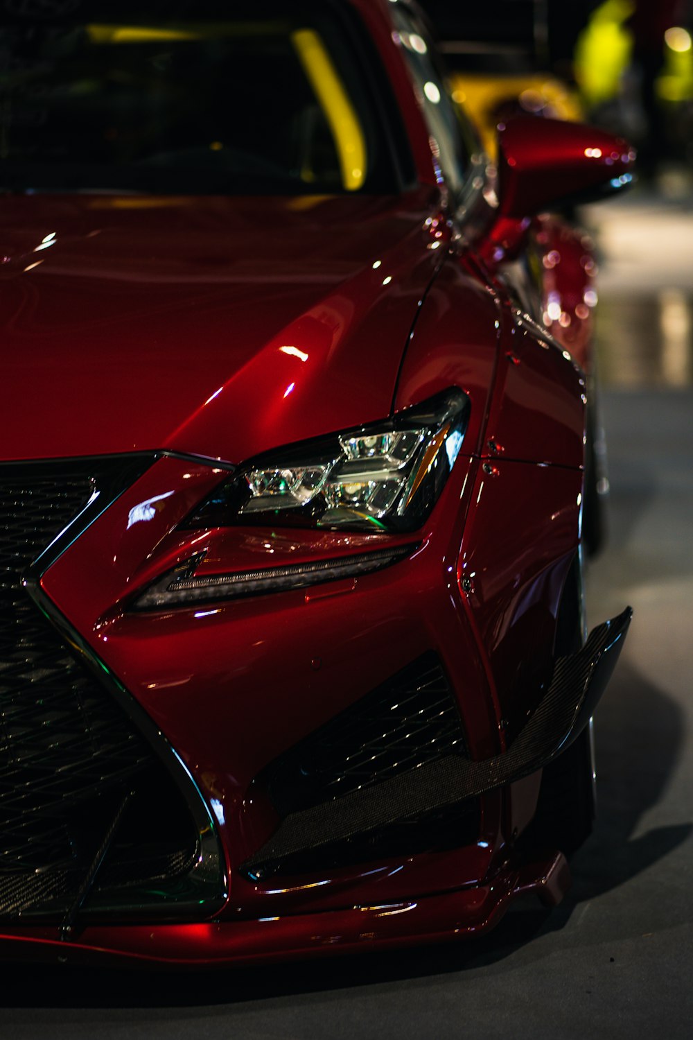 a close up of the front of a red car