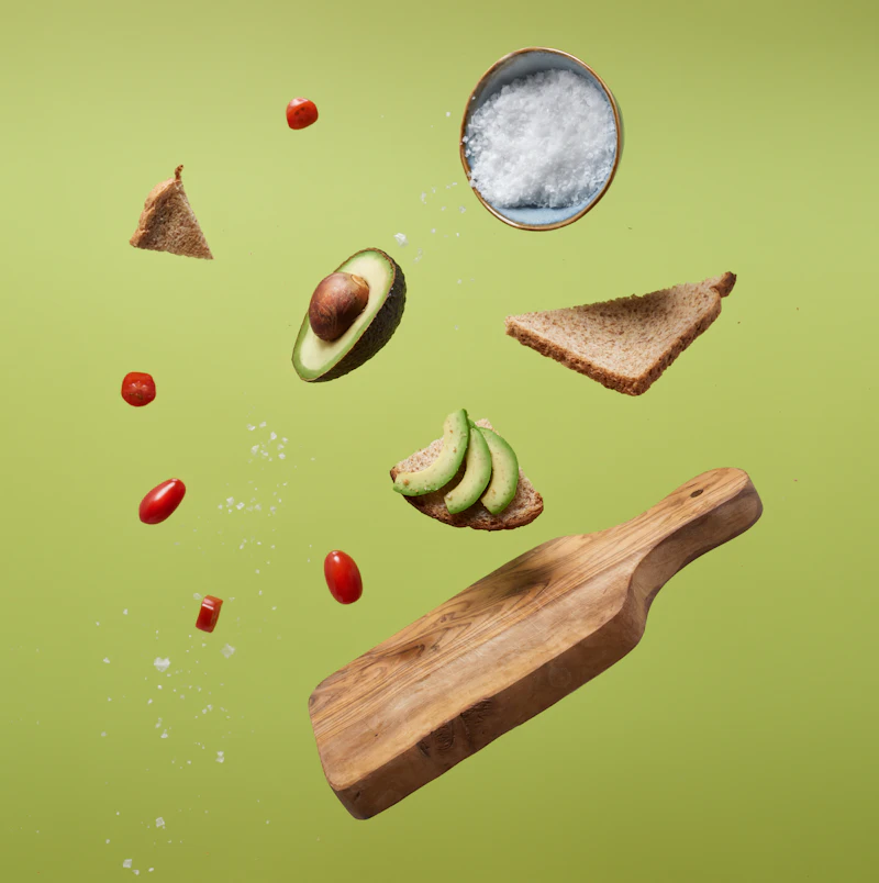 Fresh avocado, tomato, and wholegrain toast laid out for a balanced meal plan