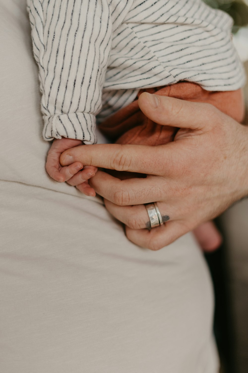 a person holding a baby in their arms